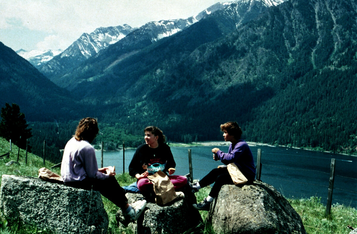 Three of Janie Tippett’s 4-H Sourdough Shutterbugs eat lunch on boulders atop Wallowa Lake’s east moraine. From left are unknown, Becky Jones, and Amy Zollman. Taken by Janie Tippett.